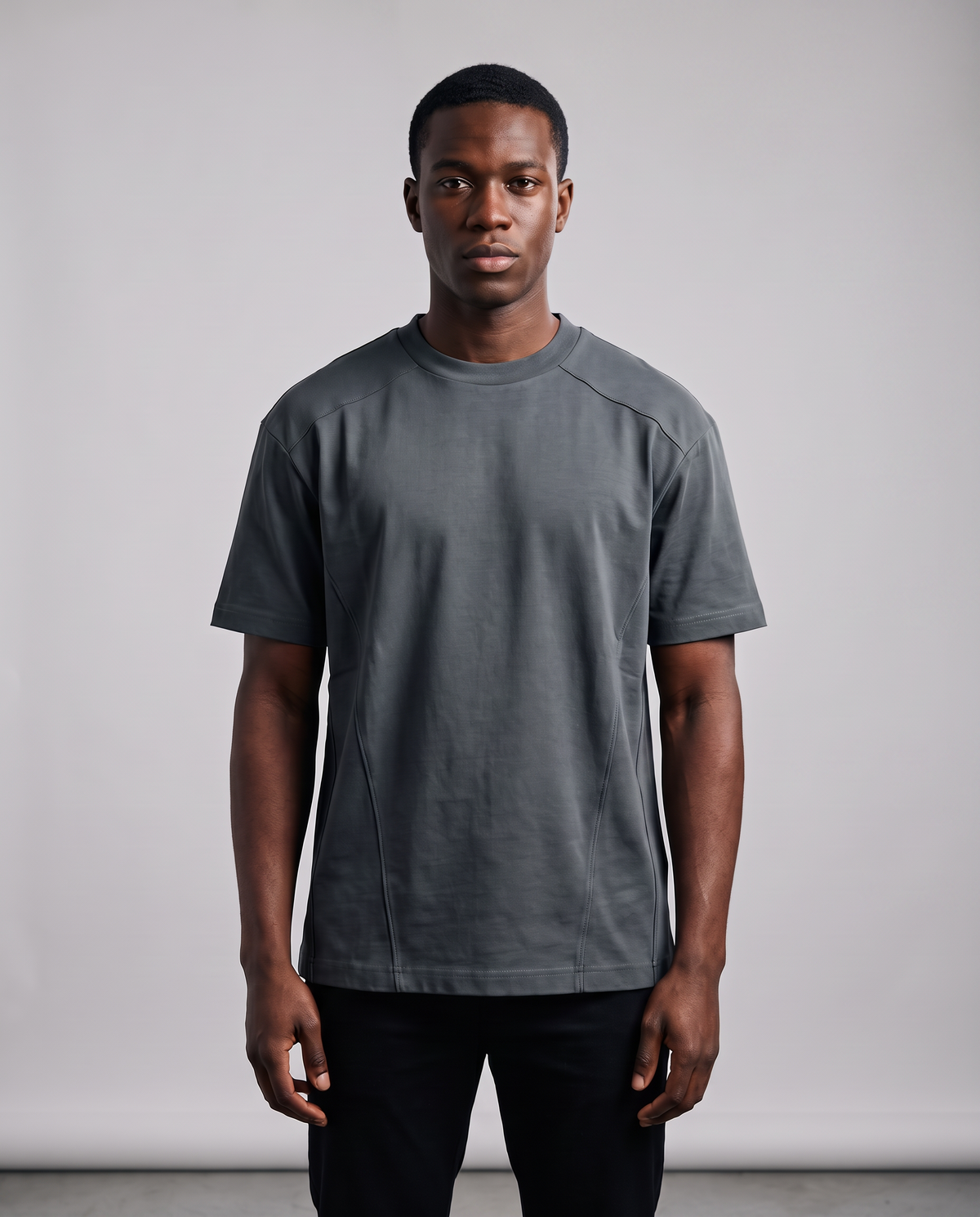 Segment Panel Crew Tee in Charcoal, studio shot on a model