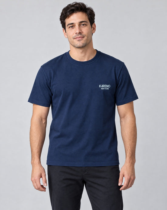 Borough Emblem Crew Tee in Navy, on model