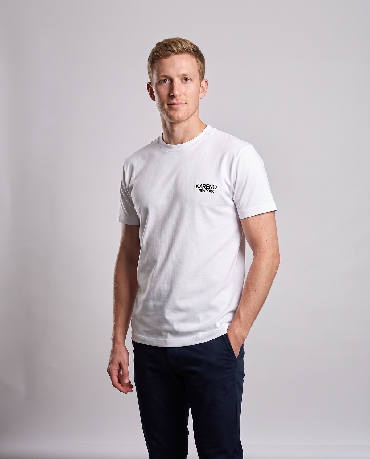 Borough Emblem Crew Tee in White, studio shot on a model